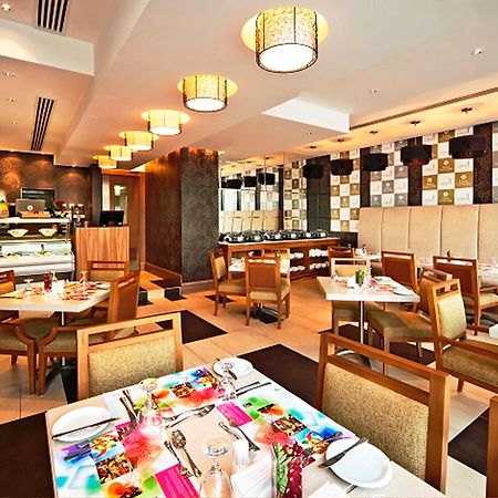 Oaks Liwa Executive Suites Абу Даби Ресторант снимка